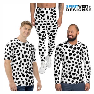 May include: Two men wearing black and white dalmatian print clothing. One man is wearing a short-sleeved t-shirt and the other is wearing a long-sleeved shirt. The man on the left is also wearing blue jeans. The man on the right is wearing black shorts. The man in the middle is wearing black and white dalmatian print leggings.