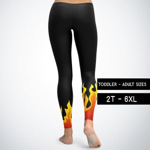 May include: Black leggings with a flame design on the lower legs. The flames are yellow and orange. The leggings are available in toddler and adult sizes, from 2T to 6XL.