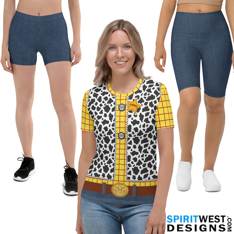 May include: A woman wearing a short-sleeved shirt with a black and white cow print and a yellow and red plaid pattern. The shirt has a sheriff's star badge with the word "SHERIFF" on it. The woman is also wearing a brown belt with a silver buckle and blue jeans. She is standing in front of a white background.