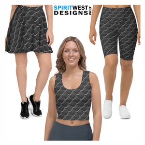 May include: Three different clothing items featuring a black and silver scale pattern. A skirt, a tank top, and biker shorts.