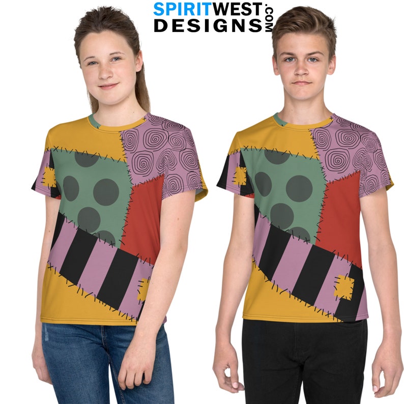 May include: Two children wearing t-shirts with a patchwork design featuring a variety of colors and patterns, including yellow, green, red, purple, and black. The shirts have a stitched look, with visible seams and stitching. The text "SPIRITWEST.COM DESIGNS" is visible at the top of the image.