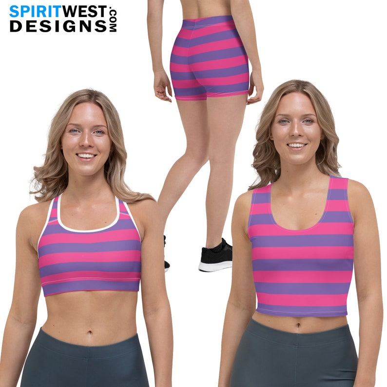 May include: Two women wearing a pink and purple striped sports bra and matching shorts. The sports bra has a white stripe around the neckline. The shorts are high-waisted and have a white stripe around the waistband.