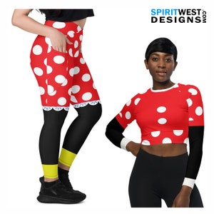 May include: Red and white polka dot leggings with a black waistband and yellow trim. The leggings have a pocket on the left side. A red and white polka dot crop top with long sleeves and a black waistband. The text "SPIRITWEST DESIGNS.COM" is in the top right corner of the image.