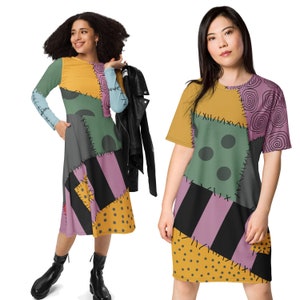 May include: Two women wearing dresses with a patchwork design inspired by the character Sally from the film "The Nightmare Before Christmas". The dresses feature a variety of colours and patterns, including yellow, green, purple, black, and white.
