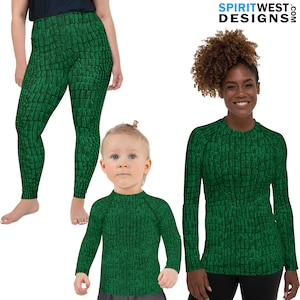 May include: A set of three green shirts with a crocodile skin pattern. The shirts are available in adult and child sizes.