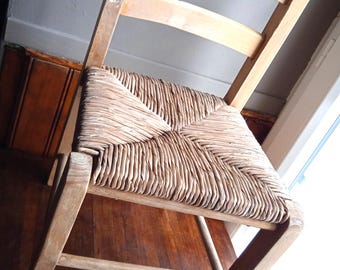 Vintage French Nursery Chair: Solid Wood & Wicker Child's Seat, Rustic Display.