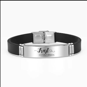 May include: Black silicone bracelet with a silver metal band that says "Trust Without Borders".