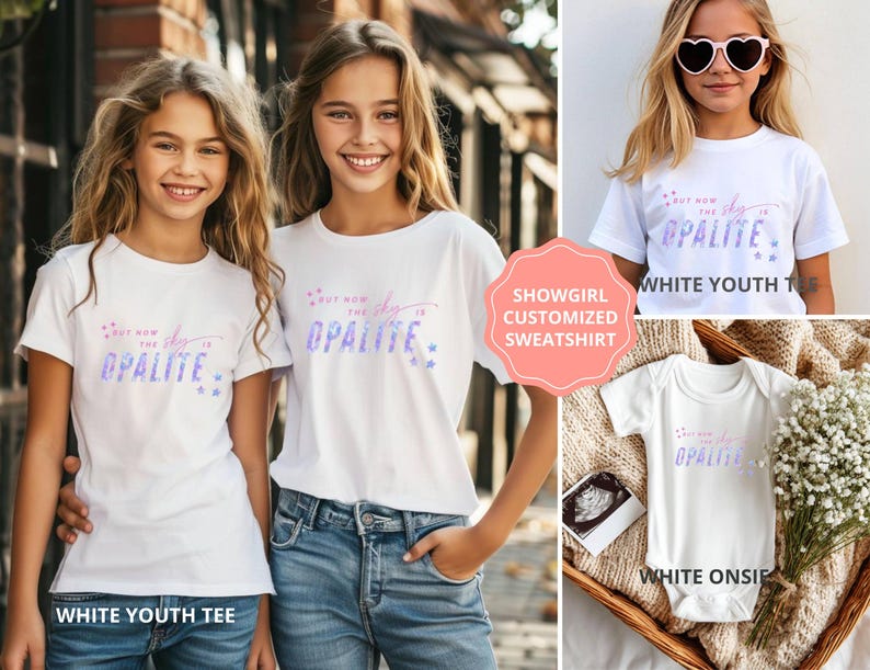 May include: White youth tees and a white onesie with the text "But now the sky is Opalite" in a gradient of pink and blue. The image also shows a customized sweatshirt.