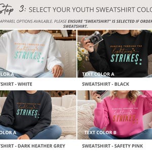 May include: Four youth sweatshirts in white, black, dark heather grey, and safety pink. Each features the text 'DANCING THROUGH THE lightning STRIKES' with star accents. The white, black, and grey shirts have teal text, while the pink has gold text.