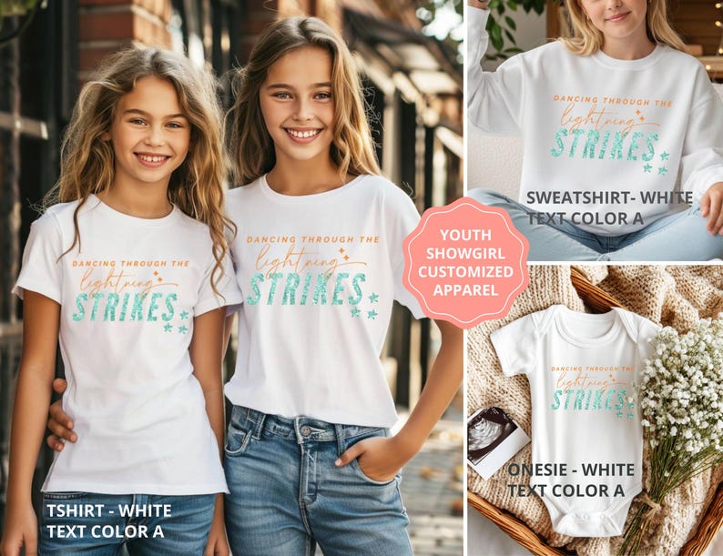 May include: White apparel including a t-shirt, a sweatshirt, and a onesie, each featuring the text Dancing Through The Lightning Strikes in orange and teal. The design includes small star accents. The items are displayed on individuals and in a basket.