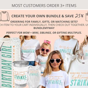 May include: A collection of white apparel and drinkware featuring teal and orange text. Items include a tall tumbler, a small cup, a baby onesie, and several t-shirts and sweatshirts. Text includes "DANCING THROUGH THE LIGHTNING STRIKES" and "BIRTHDAY GIRL".