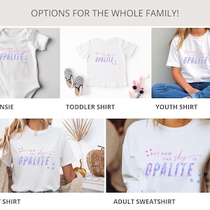 May include: White baby onesie, toddler, youth, and adult shirts, and an adult sweatshirt. Each garment features the text "But now the sky is Opalite" in a purple and blue design with star accents. The image is labeled "Options for the whole family!"