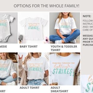 May include: A collection of white apparel including a baby onesie, baby t-shirt, youth and toddler t-shirt, youth sweatshirt, adult t-shirt, and adult sweatshirt. Each garment features the text DANCING THROUGH THE lightning STRIKES in orange and teal.