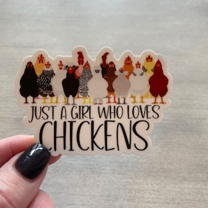 May include: White sticker with a group of cartoon chickens and the text "Just a girl who loves chickens".