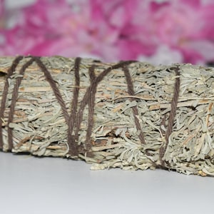 May include: A bundle of dried sage tied with twine, ready for smudging. The sage is a light gray-green color and has a natural, earthy texture.