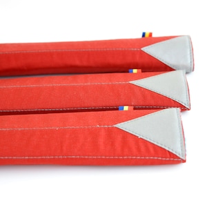 Dark red bicycle frame pad.  Top tube padding. Bike top tube protector.