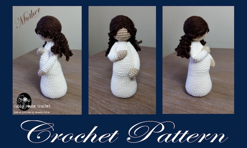 May include: Crochet pattern for a pregnant woman doll with brown hair. The doll is wearing a white dress and is standing on a wooden surface. The pattern is called "Mother" and is made by Cubby House Crochet.