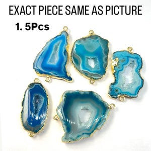 May include: Five blue agate gemstone pendants with gold-toned metal accents. Each pendant has a unique shape and features a natural crystal formation. The text "1. 5Pcs" is visible in the image.