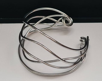 Band bracelet. Bright, light, original and elegant. German Silver (Alpacca) Titanium plated: it will brighten up your outfit!