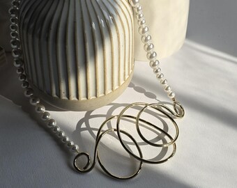 Pearls and contemporary style. Gold-plated brass necklace with genuine cultured pearls. Statement necklace. Pearl charm and style.