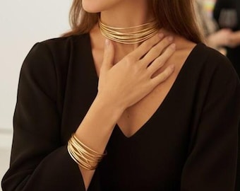 Choker necklace with gold bracelet. Contemporary jewelry. Rock-chic style. Modern choker. Statement design jewelry.