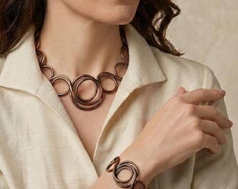 Bronze/chocolate aluminum necklace. Bright and elegant, perfect for a sophisticated gift. Modern and contemporary. Ultra-lightweight!