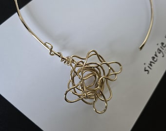 Romantic contemporary necklace, in gold plated brass, elegant and unconventional.