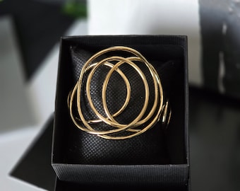 Golden bracelet "Abstract" line, in gold-plated brass, rigid bracelet, band. Contemporary, abstract and extravagant design.