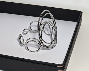Large oval bracelet, silver and bright. Light, extravagant, unconventional. A unique piece!