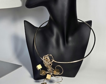 Extravagant sculpture necklace, in light gold plated brass. Style and character for women who love sophisticated accessories. Unique piece!