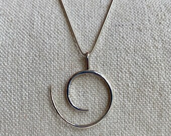 Spiral silver pendant, handmade in Cairo