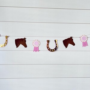 pony garland with ponies, gold foil horseshoes and pink ribbons