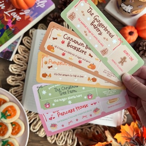 May include: A hand displays five event tickets with names such as "The Gingerbread Bakery" and "Pancake House." The tickets are decorated with illustrations of pumpkins, gingerbread men, and snowflakes. The scene includes autumn leaves, a pumpkin, and cookies.