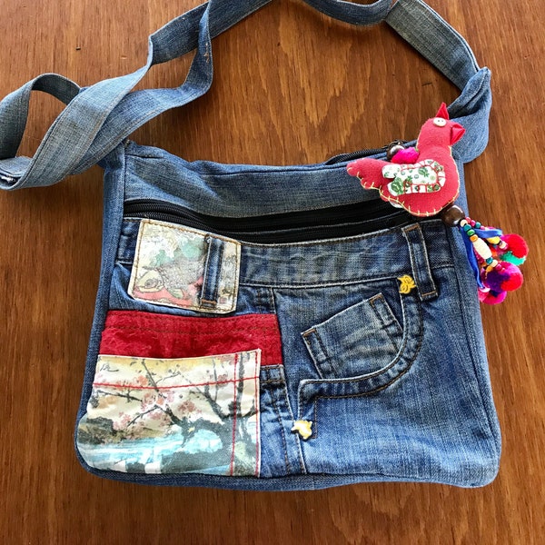 Recycled denim, OOAK, cotton, bag with a lucky rooster keychain, zippered pockets, fully lined, and long adjustable strap