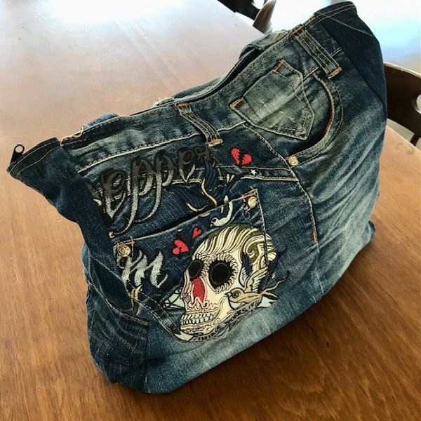 Recycled, full lined, multiple pocket, denim bag with a ton of character; skull, hearts, motorcycle bag, goth, poker, pepper, FUNctional.