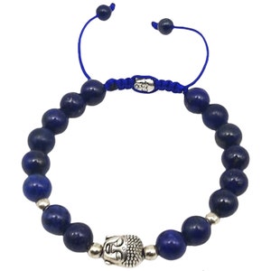 May include: A blue beaded bracelet with a silver Buddha head charm. The bracelet is made of lapis lazuli beads and has a blue cord.