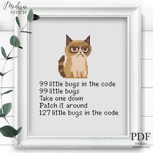 May include: Cross-stitch art featuring a pixelated grumpy cat with the text "99 little bugs in the code." The framed artwork is white with a white border and a green plant in the corner. The words "PDF" and "INSTANT DOWNLOAD" are in the bottom right corner.