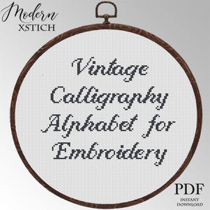 May include: A cross-stitch embroidery hoop with the text "Vintage Calligraphy Alphabet for Embroidery." The design is in black thread on a white background, framed by a wooden hoop. The words "Modern XSTICH" are at the top left.