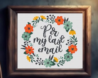 May include: Cross-stitch artwork in a wooden frame. The design features a floral wreath in orange, yellow, and teal surrounding the text "For my last email" in black script. The background is white.