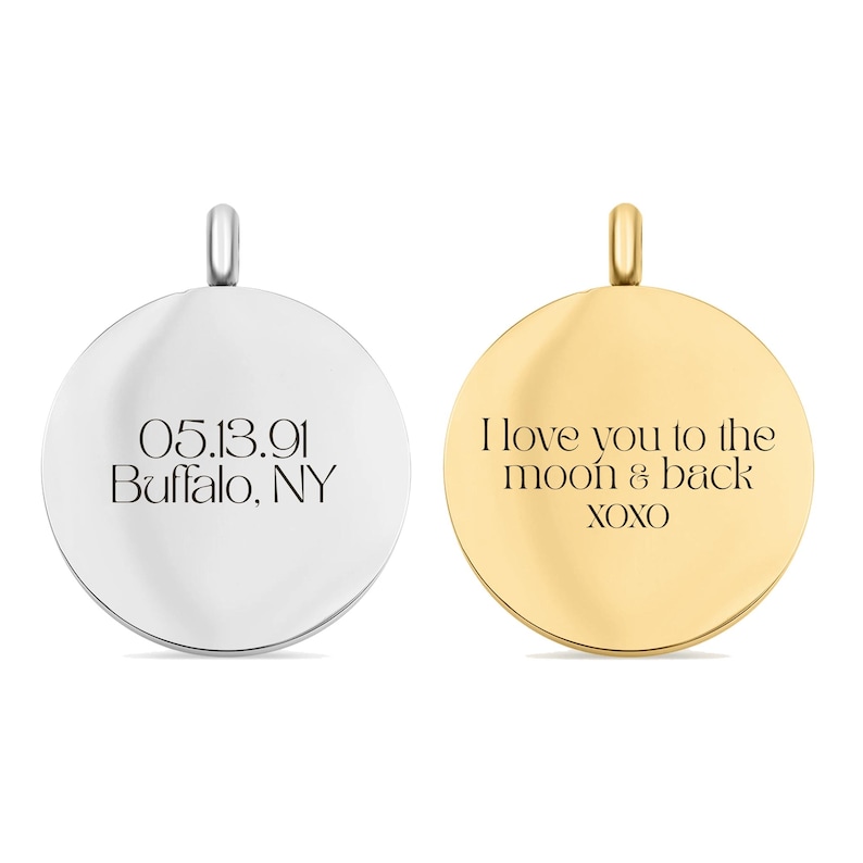 May include: Two circular metal pendants with bails. The silver-toned pendant is engraved with 05.13.91 and Buffalo, NY. The gold-toned pendant is engraved with the text I love you to the moon & back and XOXO. Both pendants have a smooth finish.