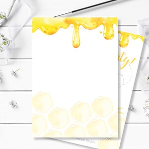 May include: A honey-themed party invitation featuring a yellow honeycomb pattern and dripping honey at the top. The text "Party!" is visible in the corner.