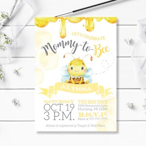 May include: A yellow and white baby shower invitation featuring a cartoon bee and the text "Let's Celebrate Mommy-to-Bee". The invitation includes the date, time, and location of the event. It also includes the text "R.S.V.P. Mave at 777-777-7777".