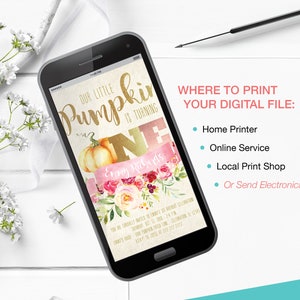 May include: A smartphone displays a digital invitation for a first birthday celebration. The design features a pumpkin illustration, floral accents, and the text "Our Little Pumpkin is Turning One."