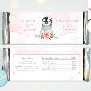 May include: A pink and white printable candy bar wrapper with a penguin illustration and the text "A Little Treat For Someone Sweet". The wrapper also includes a nutritional facts label with the text "Candy Facts" and "Amount/Serving".