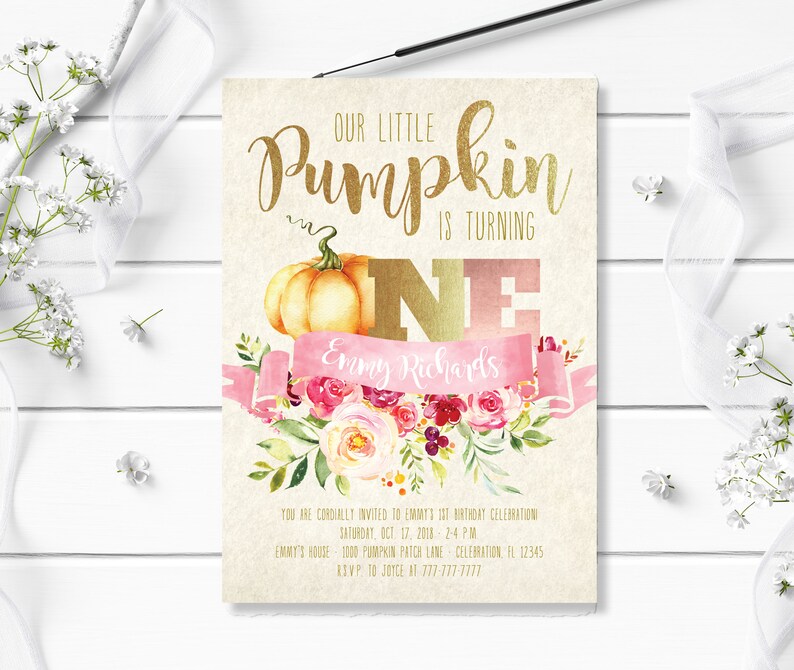 May include: A beige invitation card with gold lettering that reads "Our Little Pumpkin is Turning One." It features a watercolor pumpkin, pink floral accents, and a pink banner with a name. The card is for a first birthday celebration.