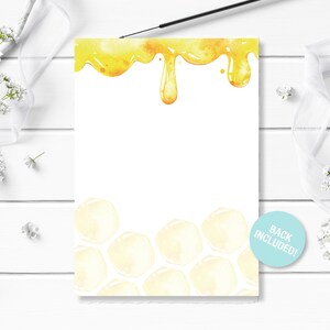 May include: A white card with a yellow honey dripping design at the top and a honeycomb pattern at the bottom. The text "Back Included!" is on a blue circle in the bottom right corner.