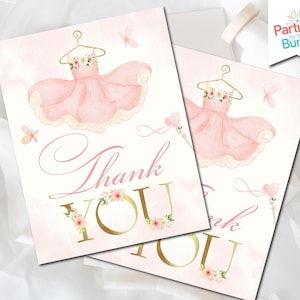 May include: Pink thank you card with a gold glitter thank you and a watercolor illustration of a ballerina dress with flowers and butterflies.