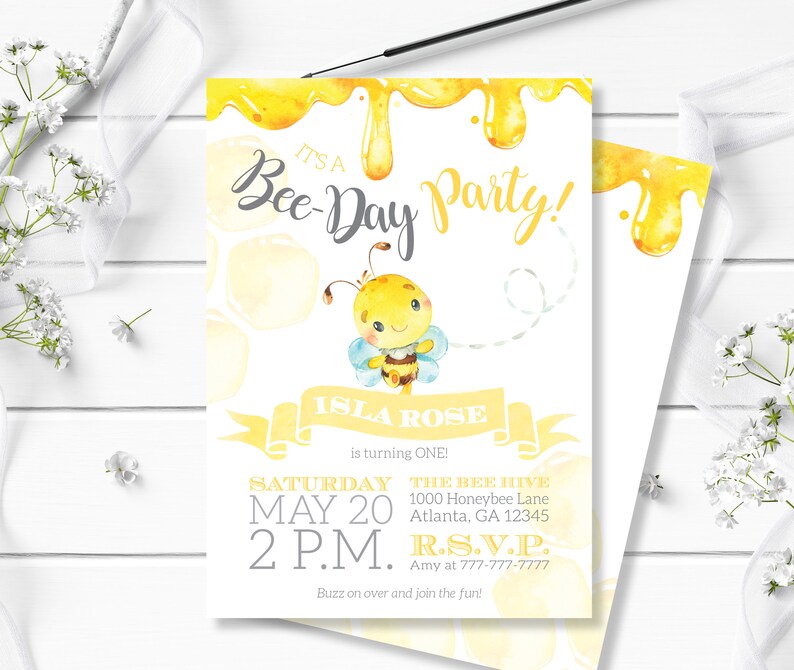 May include: A yellow and white bee-themed birthday party invitation with a cartoon bee and the text "It's a Bee-Day Party!"  Isla Rose is turning one. The party is on Saturday, 20th May at 2 p.m. at The Bee Hive, 1000 Honeybee Lane, Atlanta, GA 12345. RSVP to Amy at 777-777-7777.  Buzz on over and join the fun!