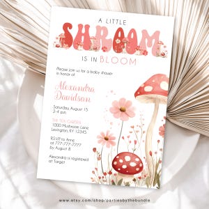 May include: A baby shower invitation with a pink and red mushroom theme. The invitation says "A Little Shroom Is In Bloom" and includes the name Alexandra Davidson, the date and time of the shower, and the location. The invitation also includes a website address for the shop that created the invitation.