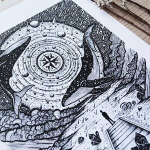 May include: Black and white illustration of two whales swimming in a starry sky with a compass in the center. The whales are surrounded by a swirling galaxy of stars and planets. The image is set against a backdrop of a rocky shore with a lone figure standing on a wooden platform.